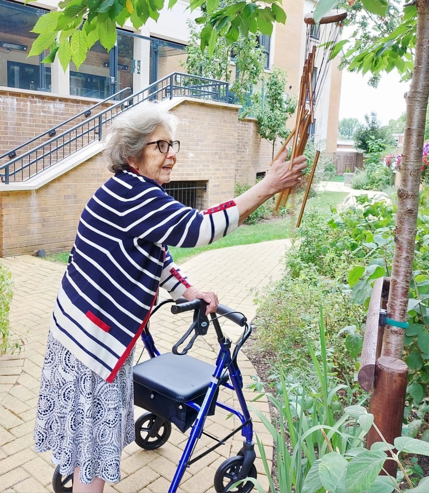 Gentle physiotherapy session for a patient living with dementia at home